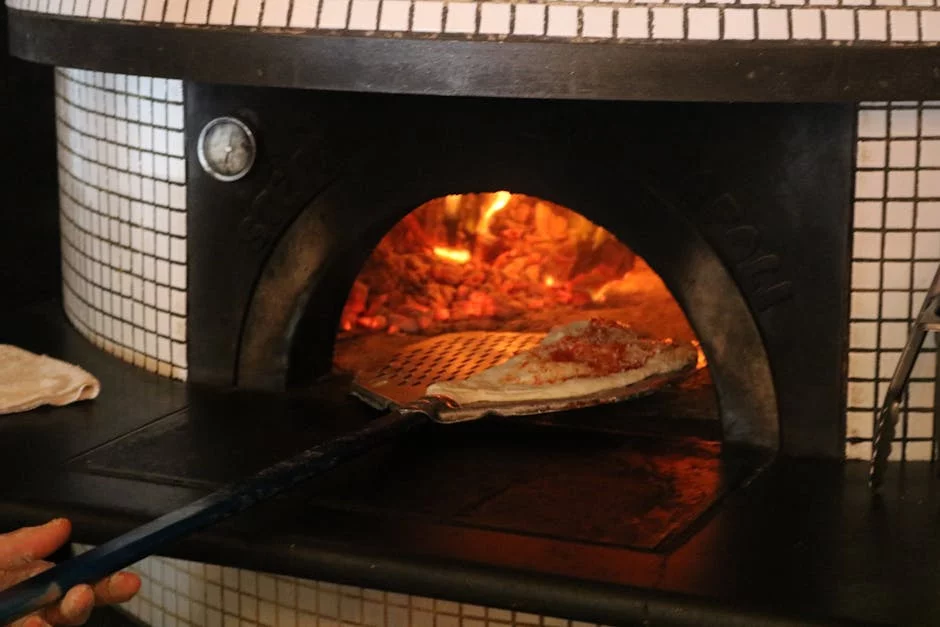 authentic wood fired pizza oven glowing flames