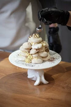 pastry chef decorating dessert kitchen